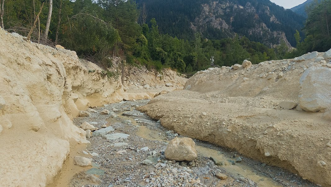 The deep riverbed of the Illgraben gives a sense of the enormous masses of scree that thunder down into the valley here.